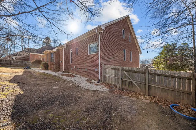 a view of a patio with a table and chairs