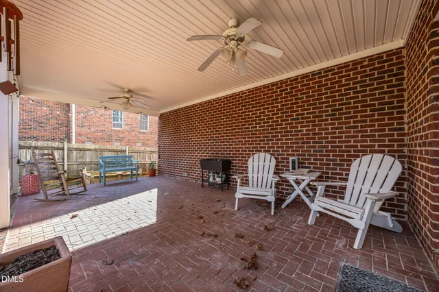 a backyard of a house with seating space