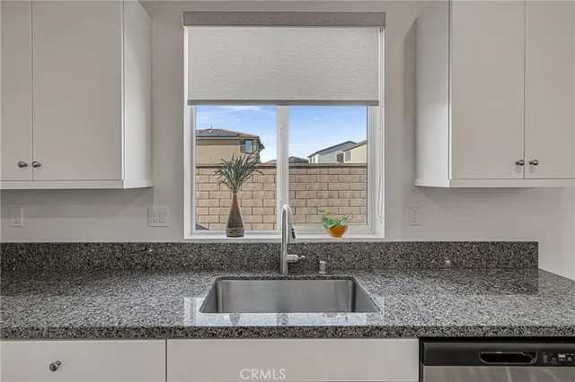 a kitchen with center island table and chairs in it