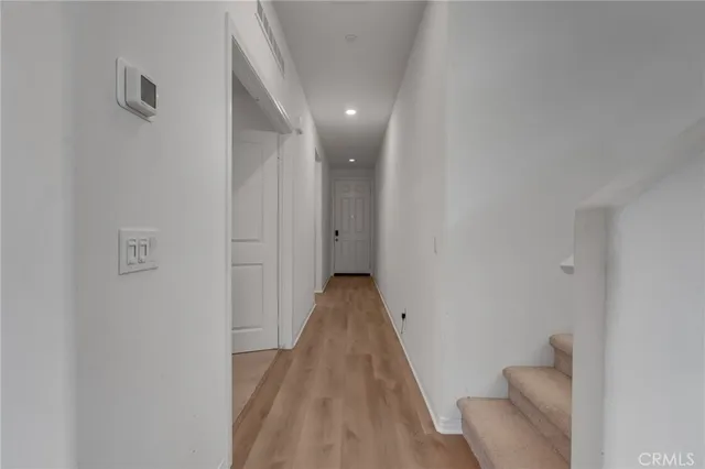 a spacious bedroom with a bed and furniture