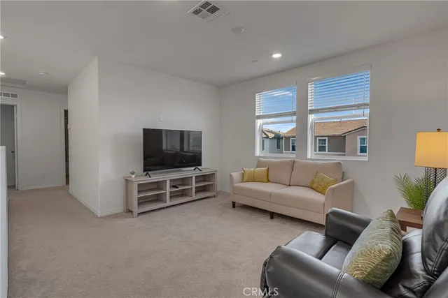 a bathroom with a double vanity sink a mirror and a bathtub
