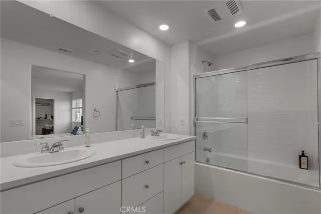 a view of a balcony with chair and wooden floor