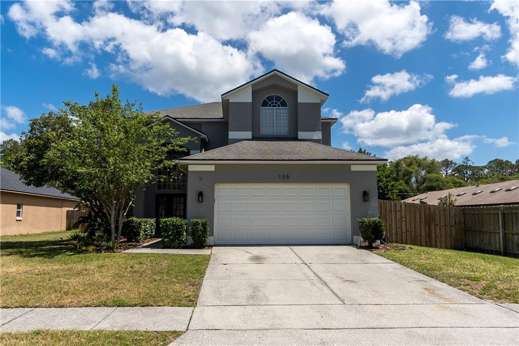 105 Lisa Loop Winter Springs, FL 32708 - Photo 1 of 1 a front view of a house with a yard