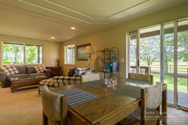 22522 Rickard Road Bend, OR 97702 - Photo 5 of 23 a living room with furniture and a large window