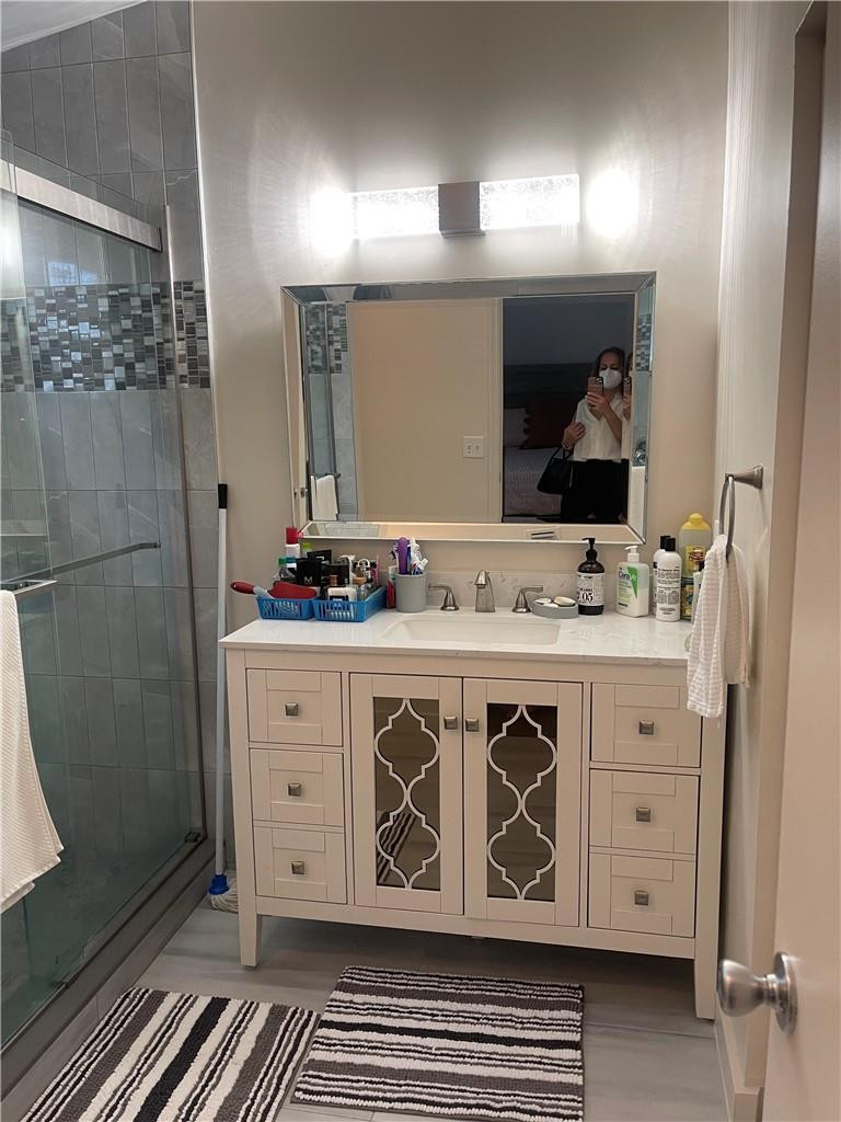 14085 Southwest 179th Terrace Miami, FL 33177 - Photo 5 of 6 a bathroom with a sink and a mirror