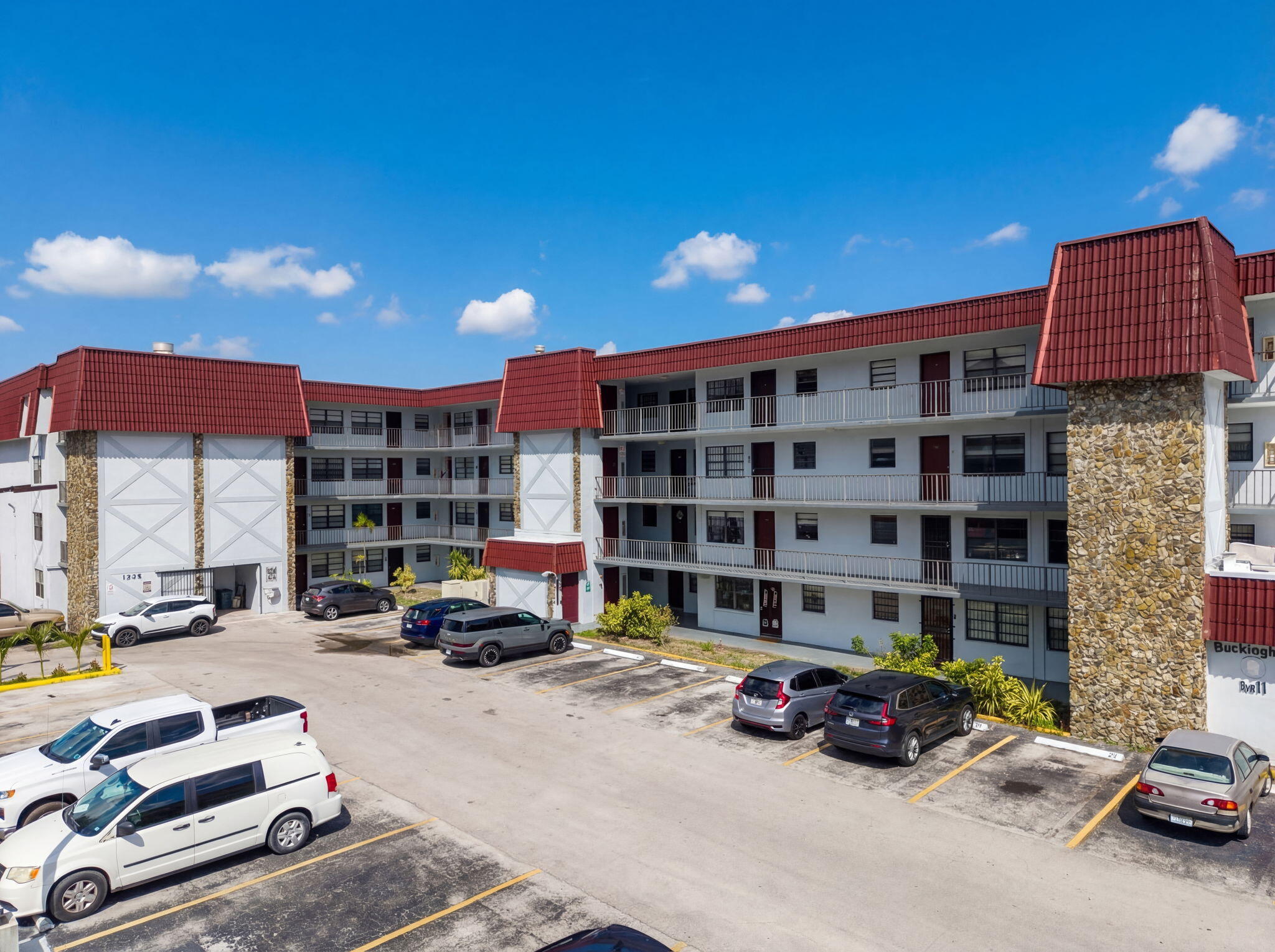 1335 West 68th Street, Unit 208 Hialeah, FL 33014 - Photo 19 of 20 a car parked in front of a building