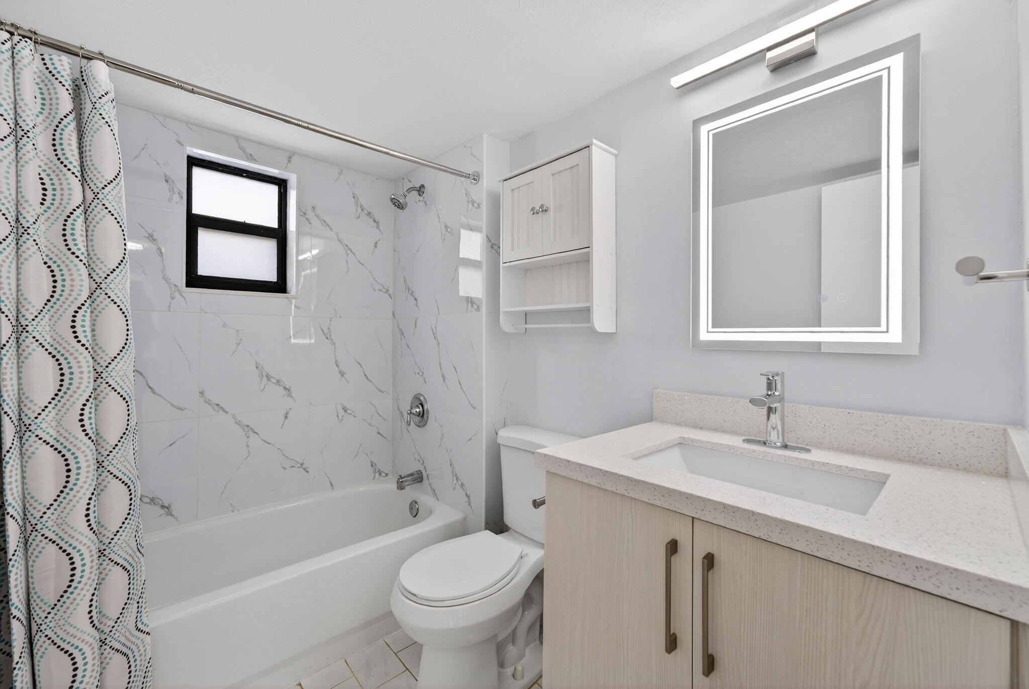 1335 West 68th Street, Unit 208 Hialeah, FL 33014 - Photo 2 of 20 a bathroom with a sink toilet and shower