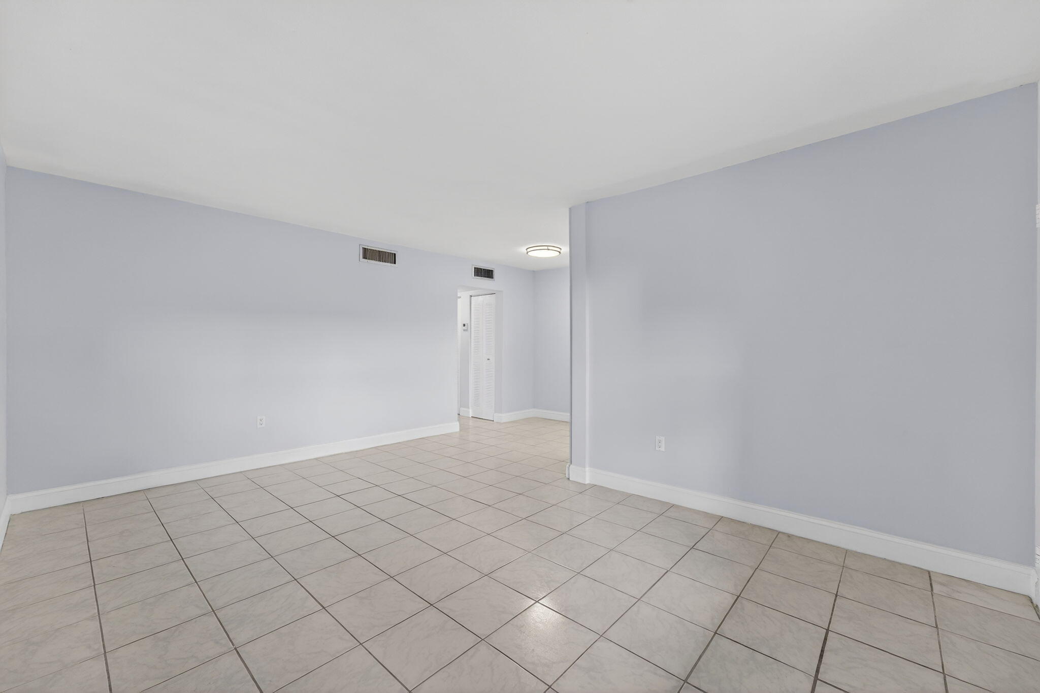 1335 West 68th Street, Unit 208 Hialeah, FL 33014 - Photo 9 of 20 a view of an empty room