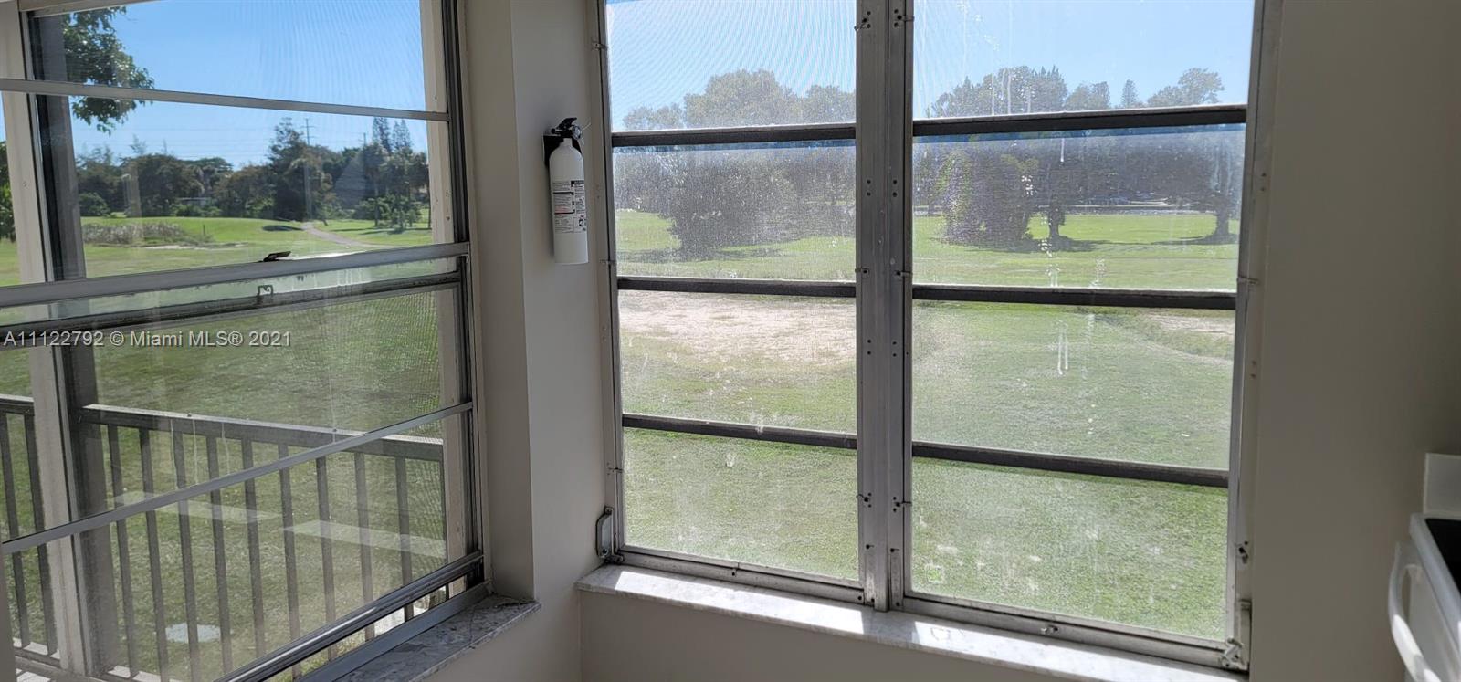 Manors of Inverrary Condominiums Lauderhill, FL 33319 - Photo 2 of 17 a view of a glass door with a chair from window