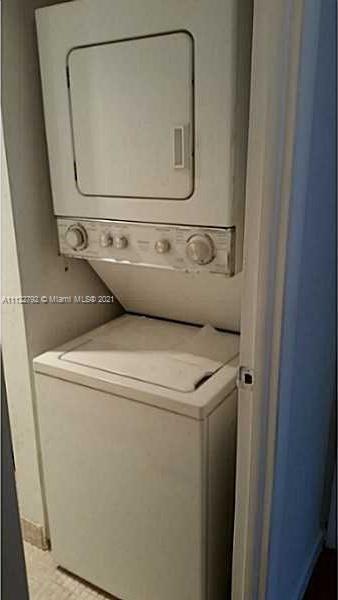 Manors of Inverrary Condominiums Lauderhill, FL 33319 - Photo 11 of 17 a utility room with dryer and washer