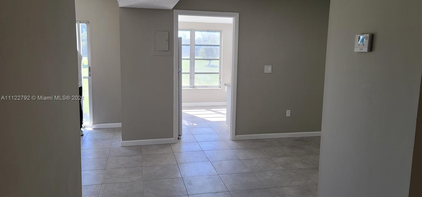 Manors of Inverrary Condominiums Lauderhill, FL 33319 - Photo 13 of 17 a view of an empty room and window