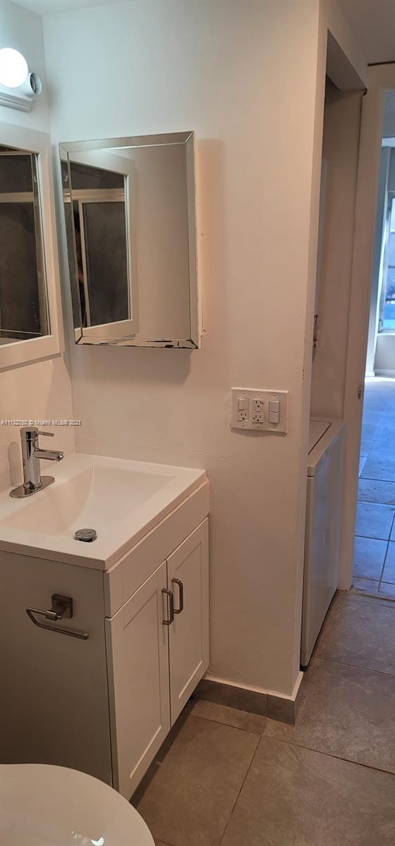 Manors of Inverrary Condominiums Lauderhill, FL 33319 - Photo 6 of 17 a bathroom with a sink a toilet and mirror