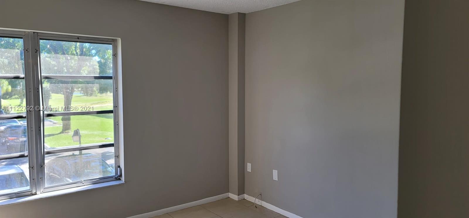 Manors of Inverrary Condominiums Lauderhill, FL 33319 - Photo 8 of 17 a view of an empty room and window