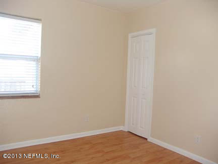 1911 Clemson Road Jacksonville, FL 32217 - Photo 21 of 26 a view of an empty room with a window