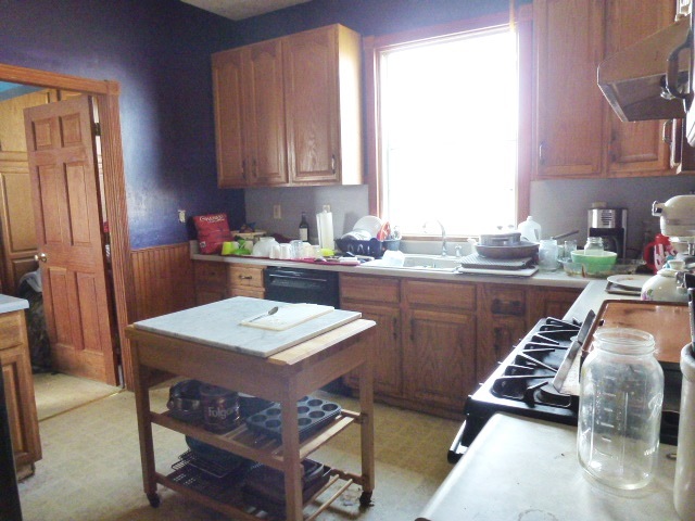 12901 Pine Road Dewitt, IL 61735 - Photo 8 of 23 a kitchen with a sink a stove a refrigerator and cabinets
