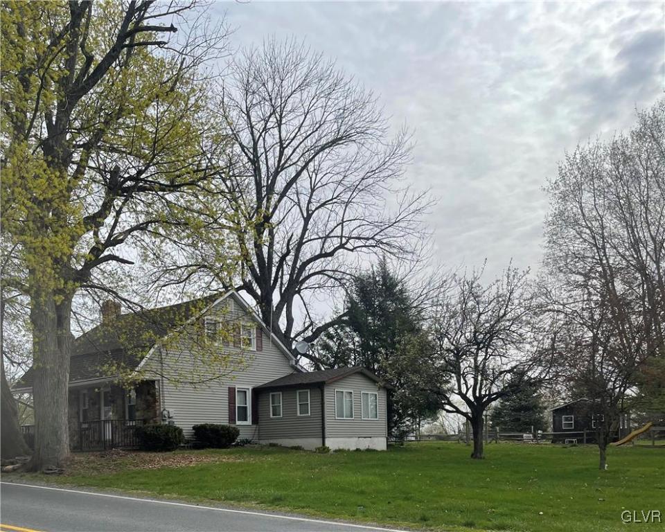 556 Jacobsburg Road Nazareth, PA 18064 - Photo 14 of 18 a view of a big yard next to a house