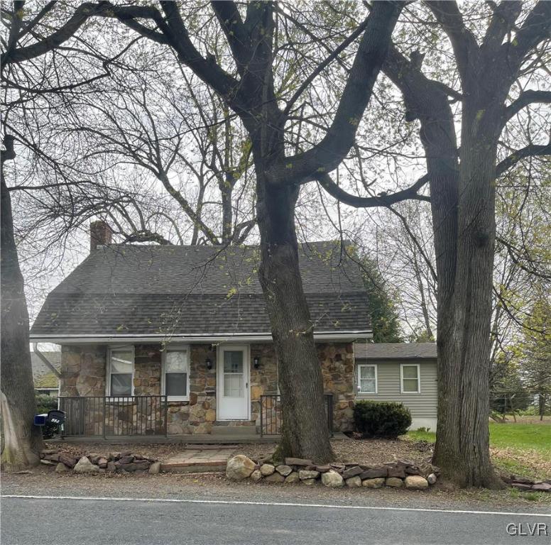 556 Jacobsburg Road Nazareth, PA 18064 - Photo 2 of 18 a front view of a house with yard and trees