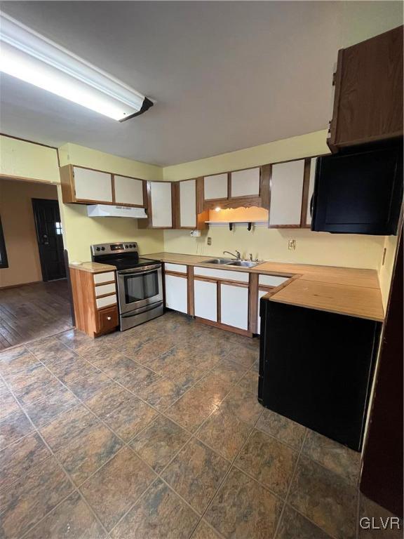 556 Jacobsburg Road Nazareth, PA 18064 - Photo 3 of 18 a kitchen with stainless steel appliances granite countertop a stove a sink and a microwave