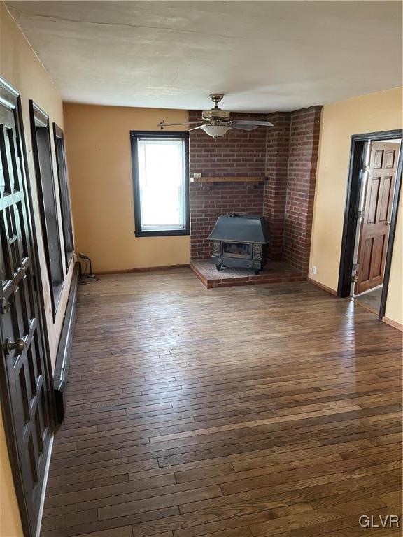 556 Jacobsburg Road Nazareth, PA 18064 - Photo 5 of 18 a view of a livingroom with wooden floor and a fireplace