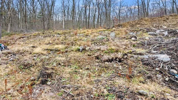 a view of covered with wooden fence