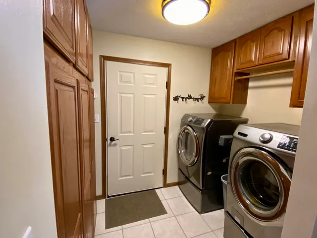 a view of storage and utility room with washer and dryer