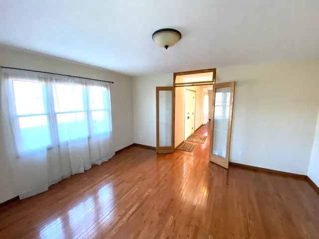 a bed room with a bed and a television