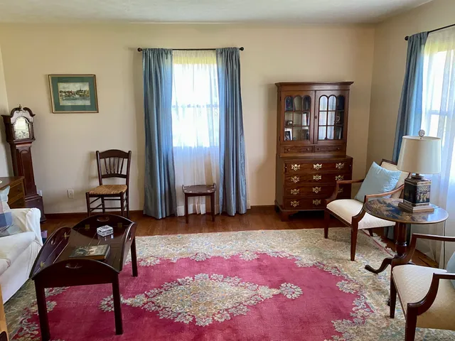 a room with a workspace and a window