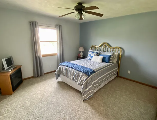 a bathroom with a sink a mirror and a shower