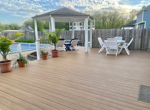 a patio with table and chairs