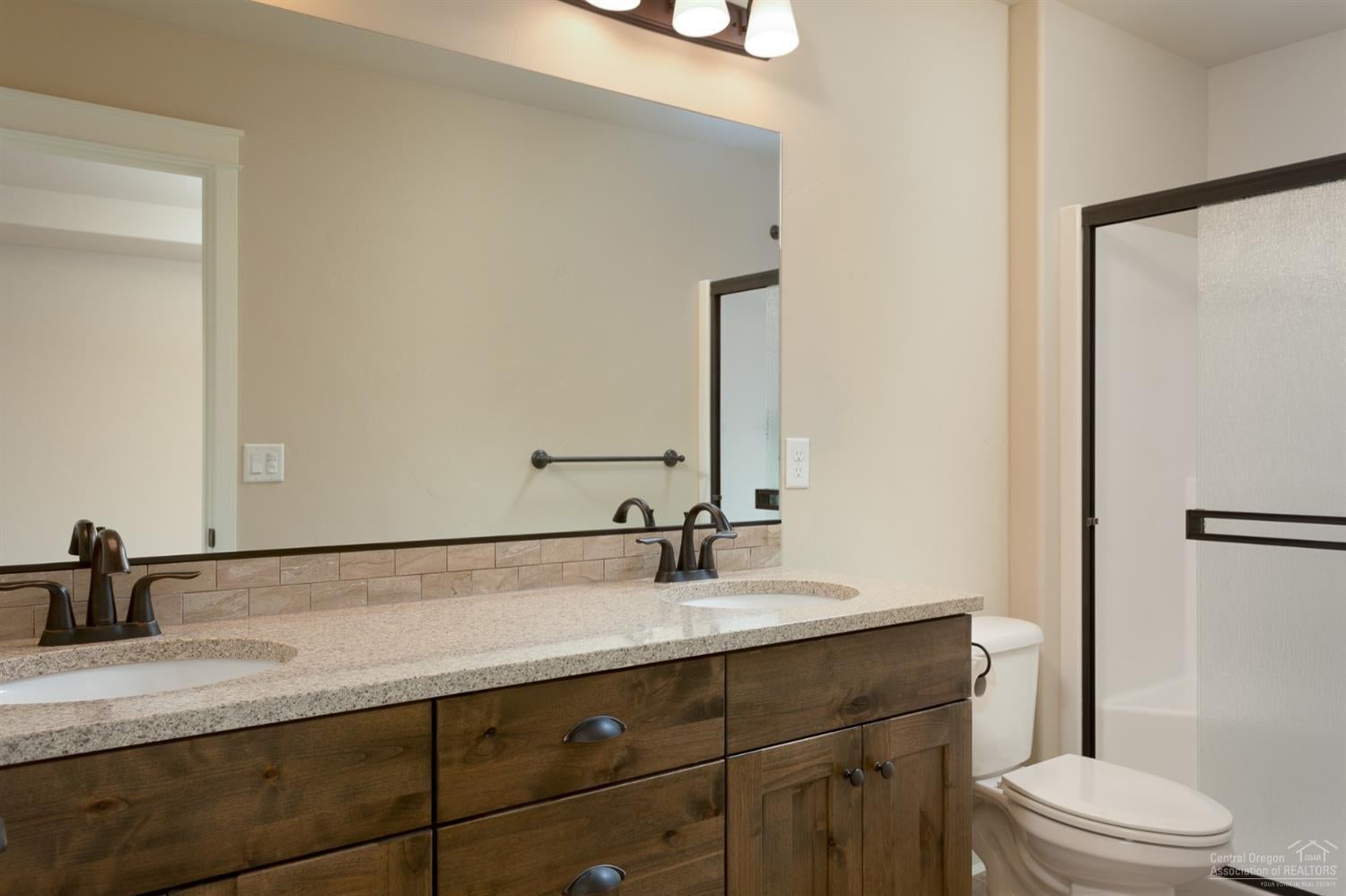 20945 Sotra Loop Bend, OR 97702 - Photo 11 of 25 Master bath with dual sinks, knotty alde