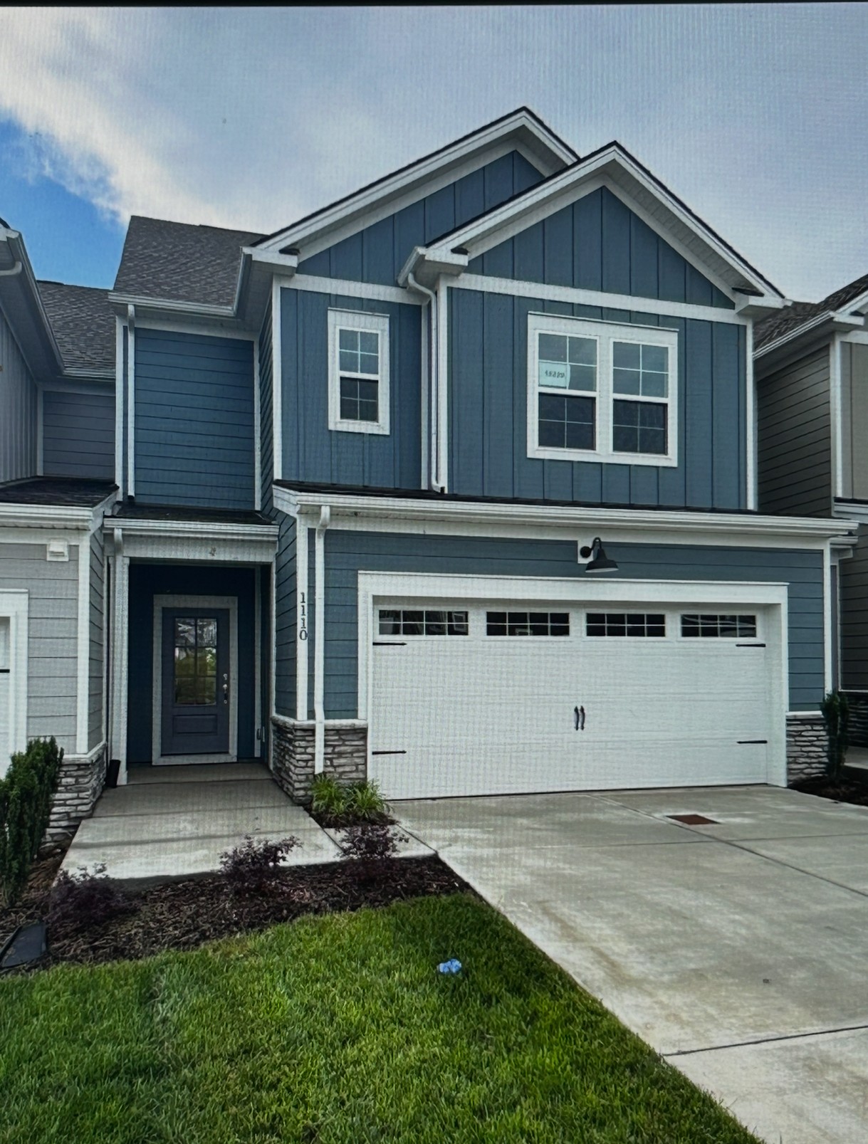 1079 June Wilde Ridge Spring Hill, TN 37174 - Photo 1 of 1 a front view of a house with a yard and garage
