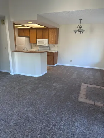 a room with kitchen island cabinets and window