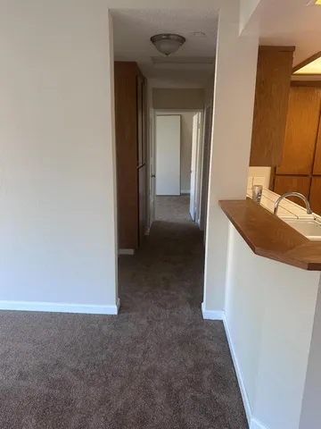 a view of a bathroom from a hallway