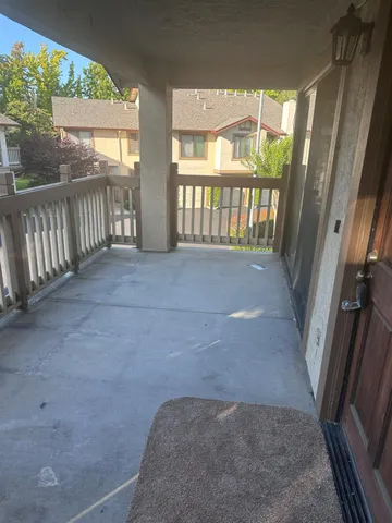 a view of hallway with a porch