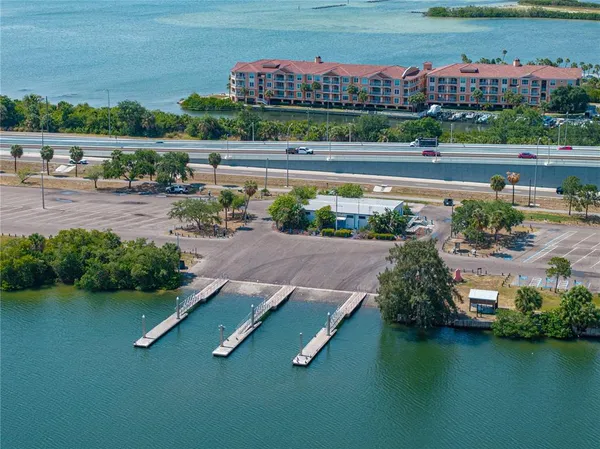 an aerial view of a house with a lake view