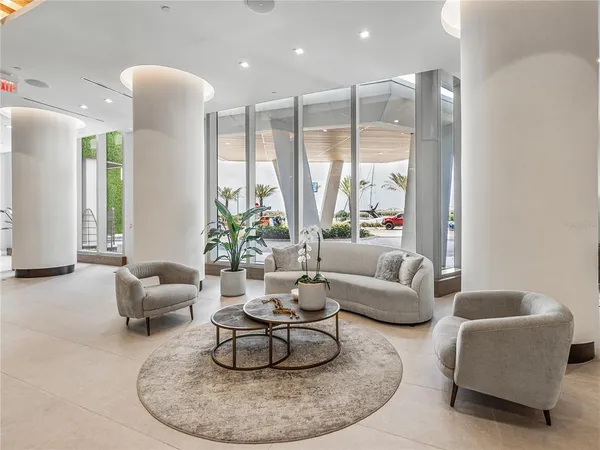 a very nice looking room with chairs and furniture