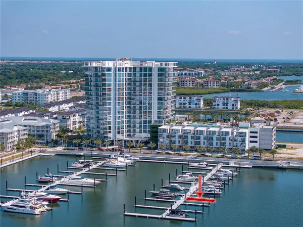 a view of ocean and building with swimming pool and ocean view