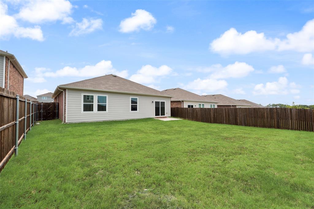 708 Peach Tree Lane Anna, TX 75409 - Photo 29 of 32 a view of a backyard of the house