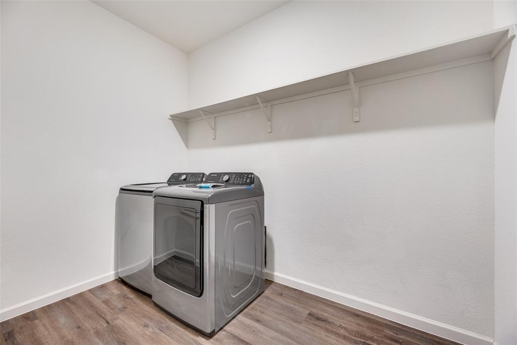 708 Peach Tree Lane Anna, TX 75409 - Photo 3 of 32 a utility room with dryer and washer