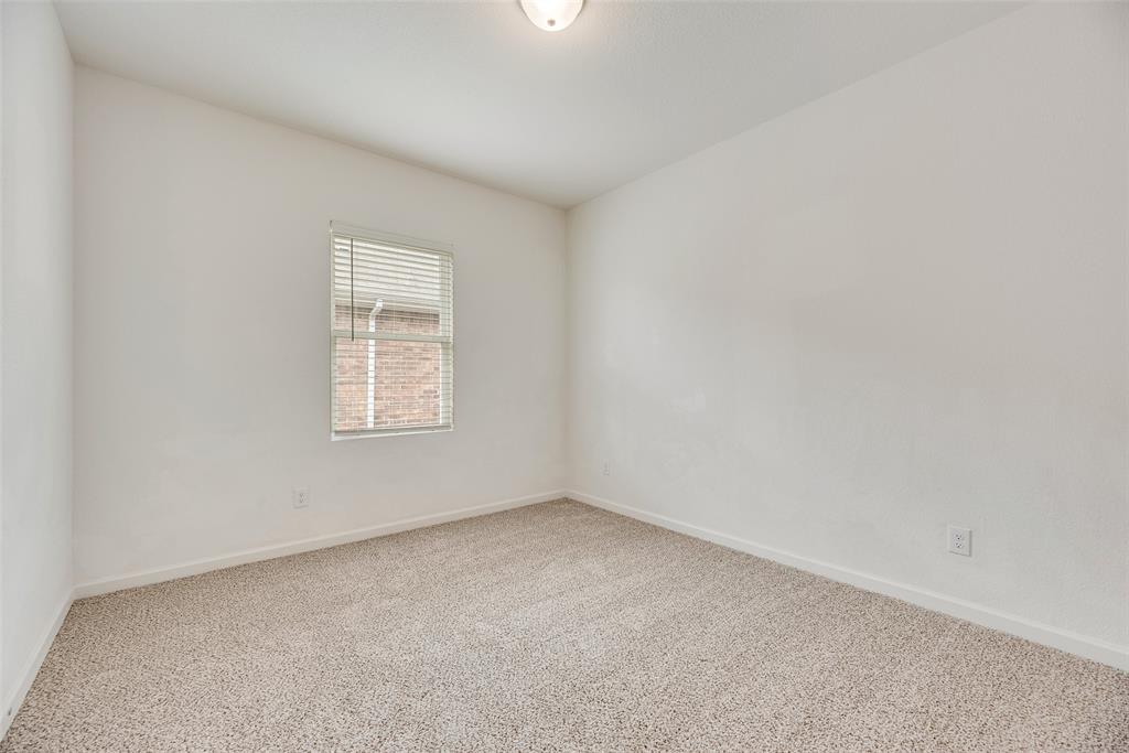 708 Peach Tree Lane Anna, TX 75409 - Photo 9 of 32 an empty room with a window