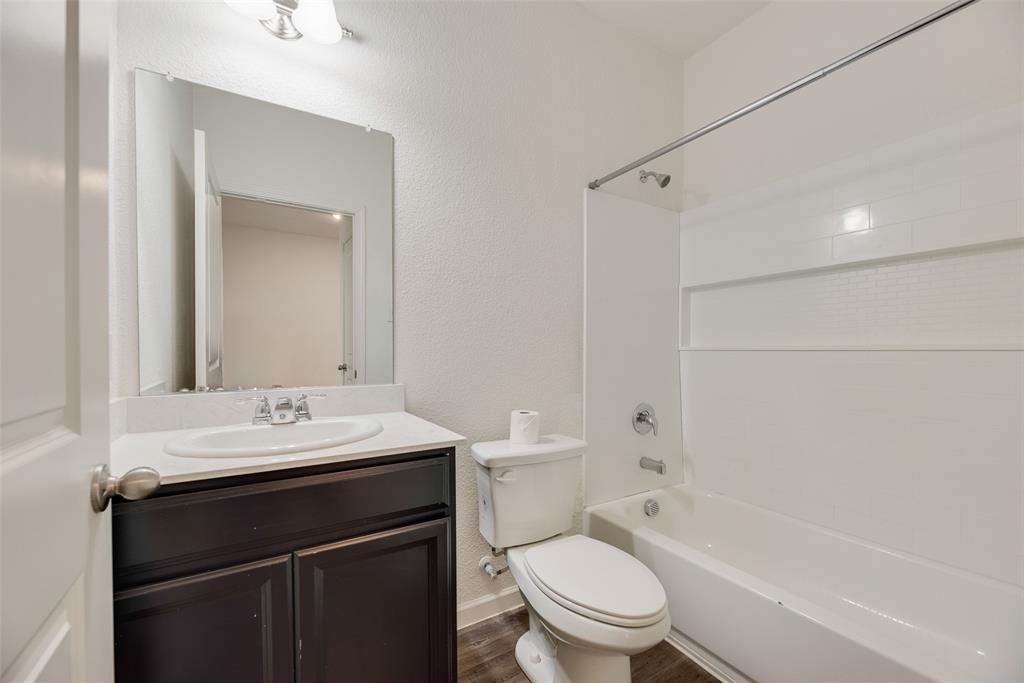 708 Peach Tree Lane Anna, TX 75409 - Photo 10 of 32 a bathroom with a sink a toilet and shower