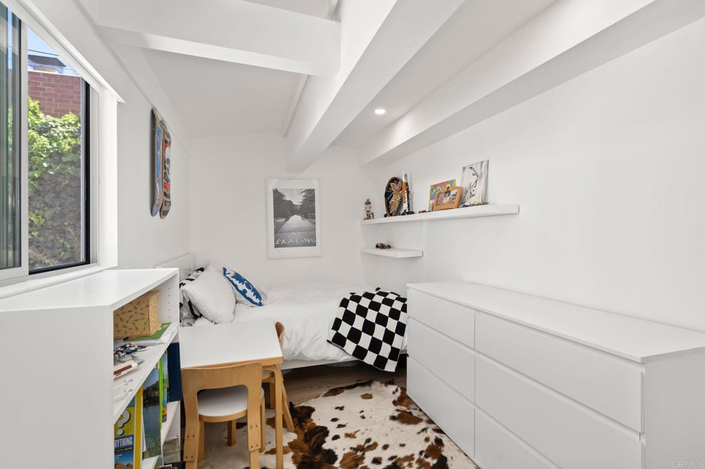 612 8th Street Del Mar, CA 92014 - Photo 11 of 12 a bedroom with a bed and a window