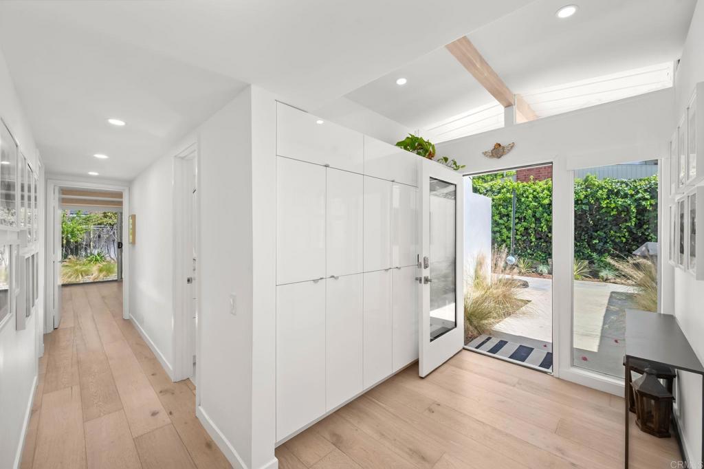 612 8th Street Del Mar, CA 92014 - Photo 12 of 12 a view of a hallway with wooden floor and windows