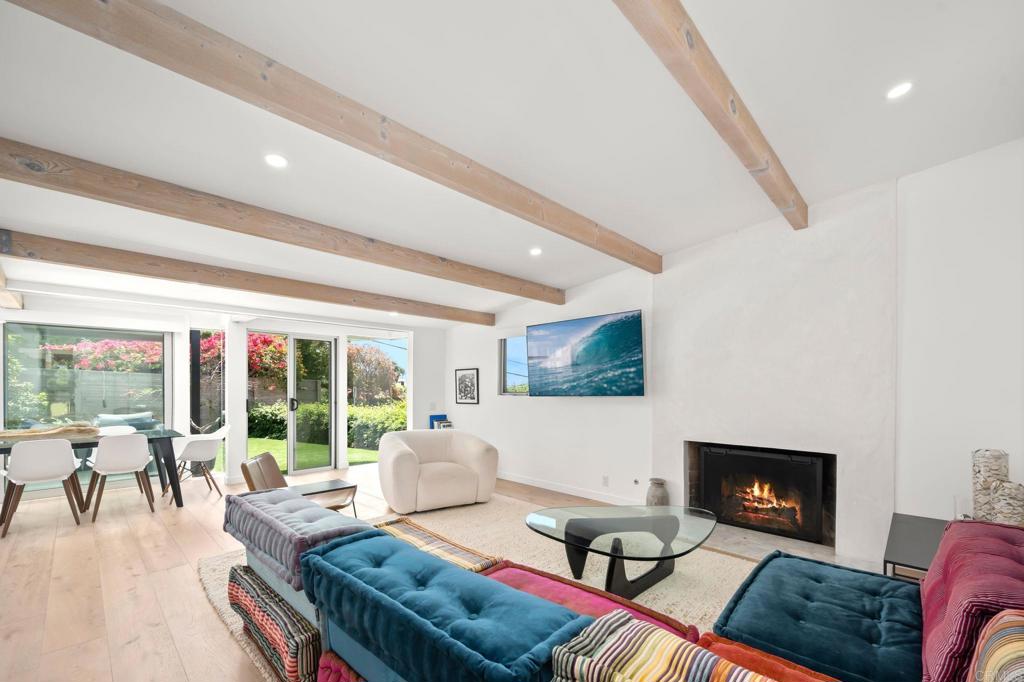 612 8th Street Del Mar, CA 92014 - Photo 2 of 12 a living room with furniture and a fireplace