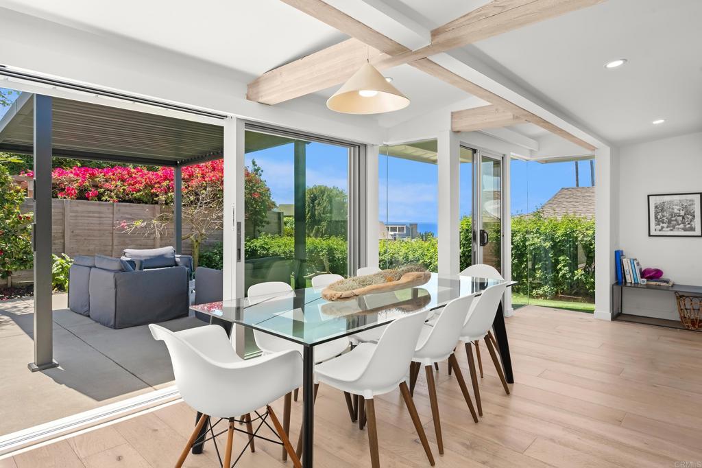 612 8th Street Del Mar, CA 92014 - Photo 3 of 12 a view of a dining room with furniture window and outside view