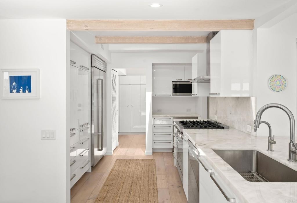 612 8th Street Del Mar, CA 92014 - Photo 4 of 12 a kitchen with stainless steel appliances a sink stove and refrigerator