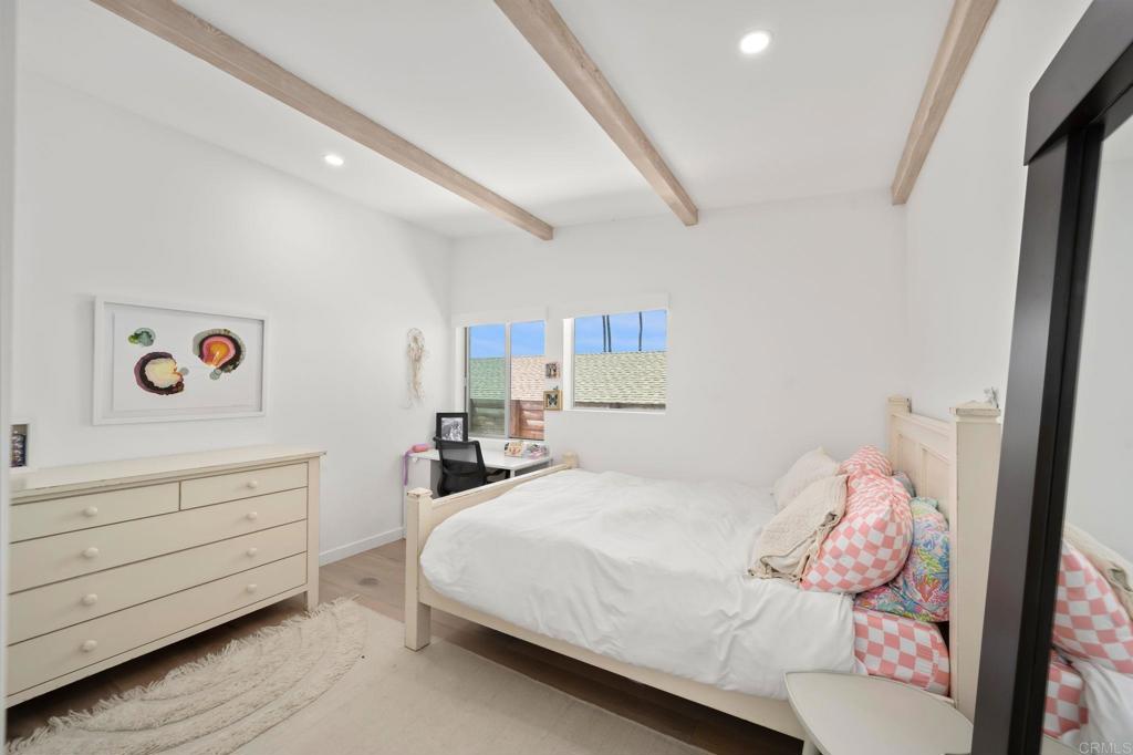 612 8th Street Del Mar, CA 92014 - Photo 8 of 12 a bedroom with a bed and a window