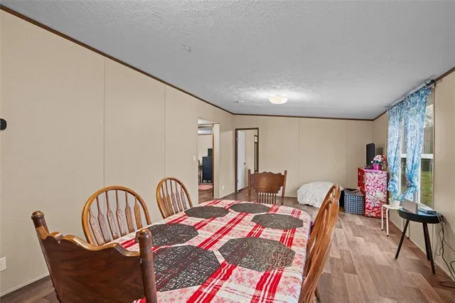 a bedroom with furniture and wooden floor