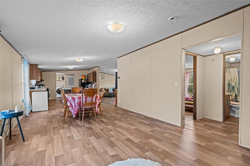 1185 Shirley Road Southeast Fairmount, GA 30139 - Photo 20 of 50 a view of a dining room with furniture and wooden floor