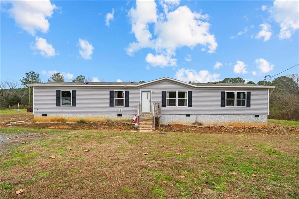 1185 Shirley Road Southeast Fairmount, GA 30139 - Photo 2 of 50 a front view of a house with a yard